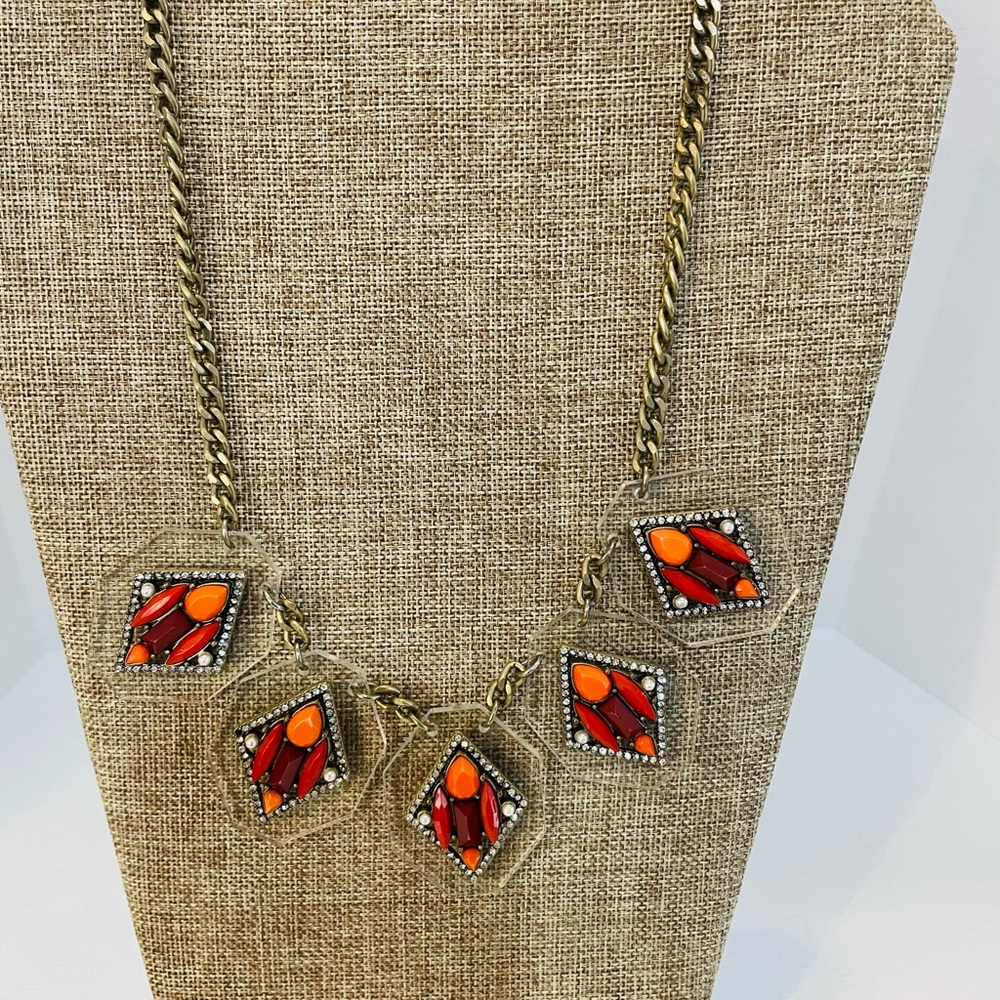 J crew colorful beaded necklace. 18” Sat on a clear diamond shaped background.